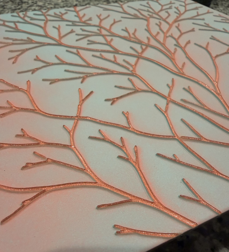Botanical panel viewed at an angle with natural shadows beneath the branches