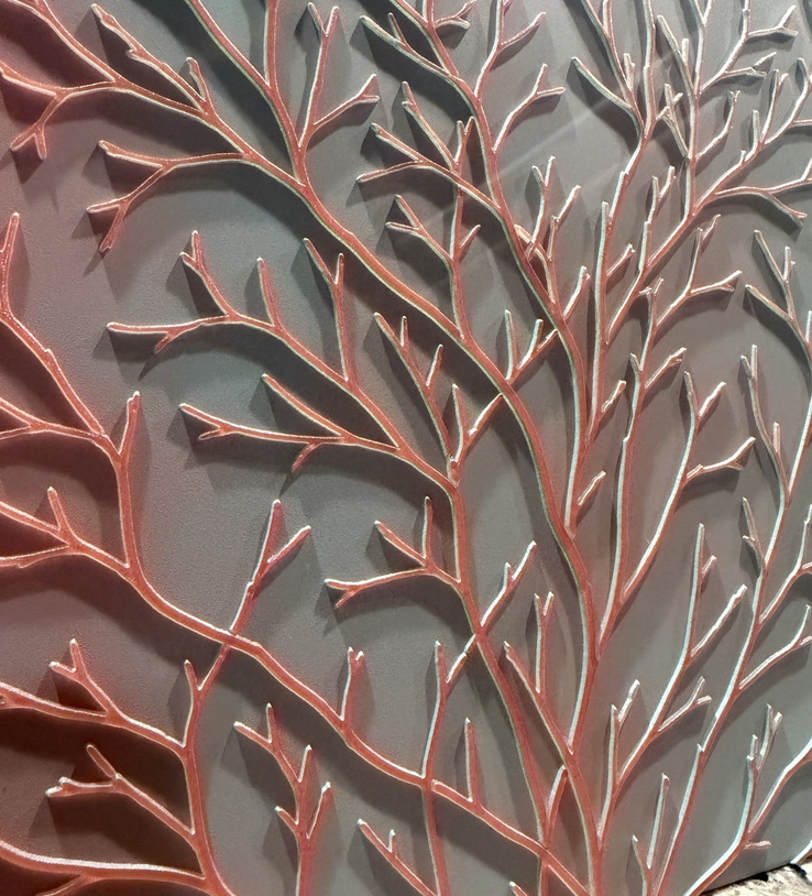 Raised botanical branches casting deep shadows across the panel